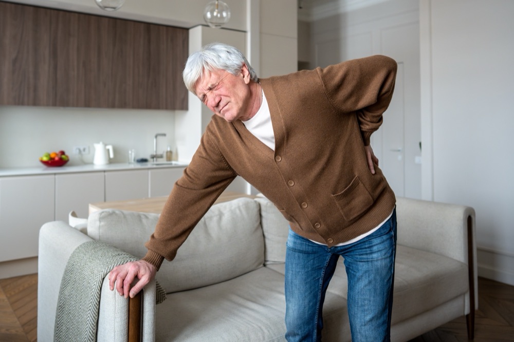 Person twisting with sudden back pain